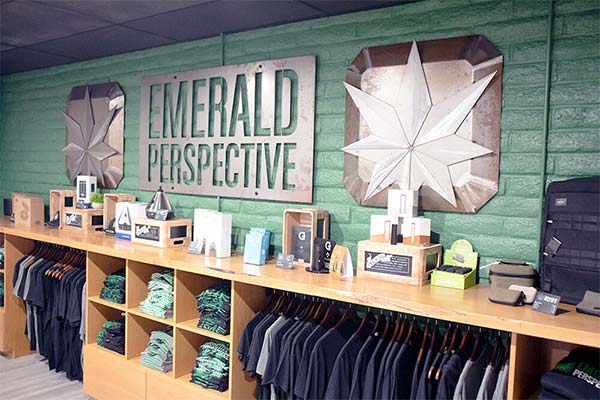 Interior image of CBD products delivered by top CBD dispensary near Agoura Hills CA featuring display sign along with clothing for retail.
